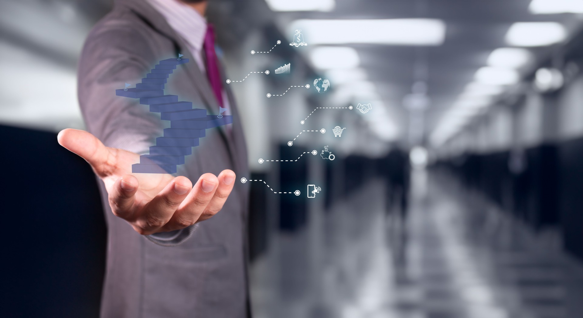 businessman holds staircase hologram exemplifying the concept of business goals