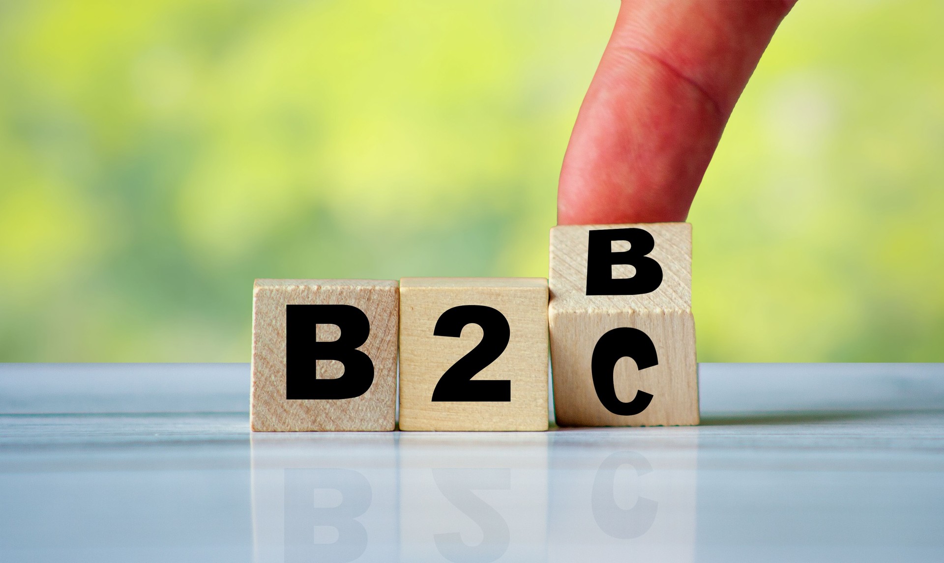 Hand turn wooden cube block and change text B2C to B2B